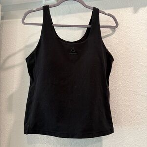 Reebok tank top, cropped and with support cups and shelf. Gently used condition.
